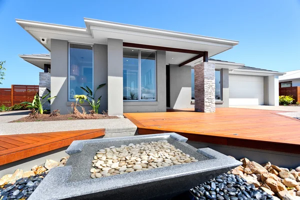 Big house and garden filled with stones — Stock Photo, Image