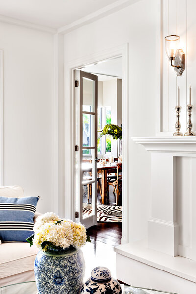 Aritificial fish and books kept on the table in a room