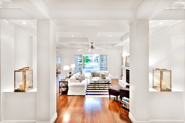 Modern living room with white walls and pillars