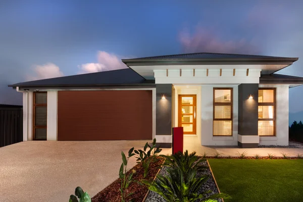 Modern mansion with a garage showing the front side — Stock Photo, Image