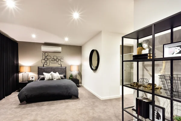 Dark color bedroom with a shelf included antiques — Stock Photo, Image