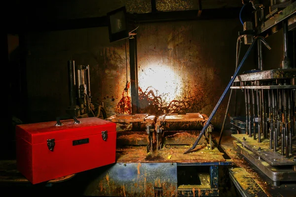 Dirty old workshop in a dark room with metal machines — Stock Photo, Image