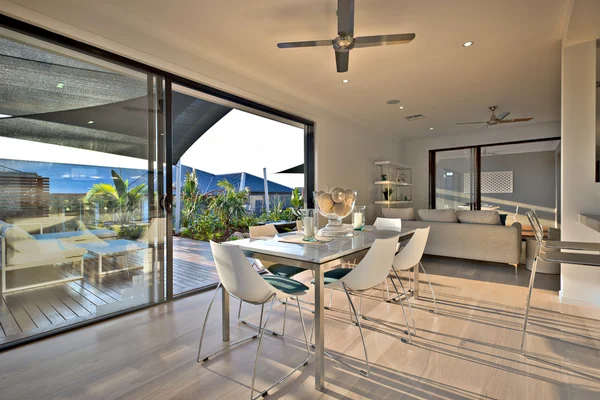 Dinner on the wooden floor with a glass door entrance — Stock Photo, Image