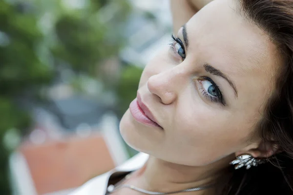 A closeup of a woman with blue eyes Stock Picture