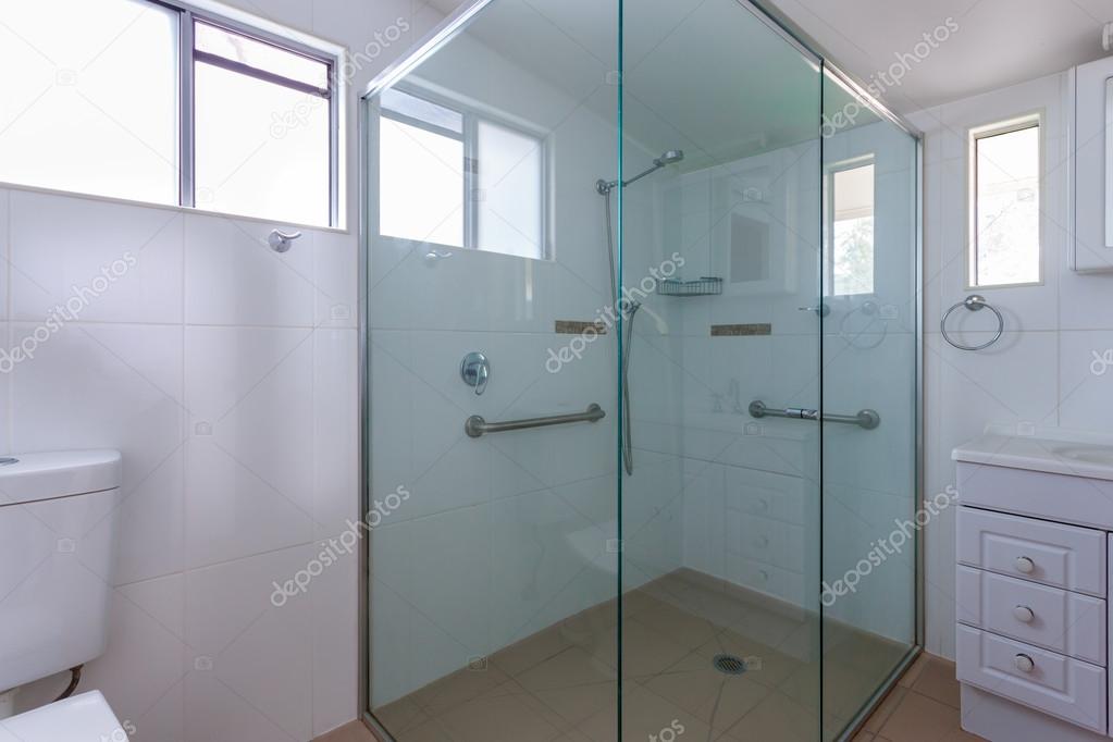 Spacious shower cabin with handles