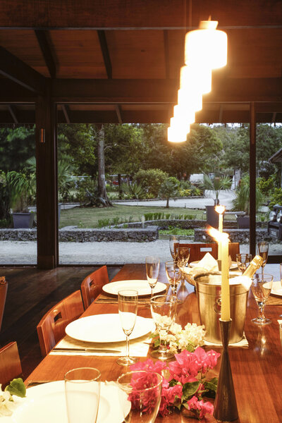 Wooden table set for dinner