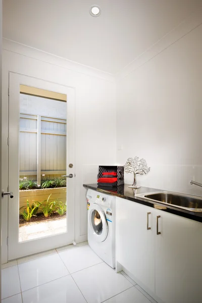 Beautiful washing room with a washing machine — Stock Photo, Image