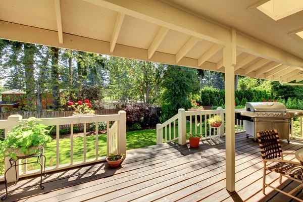 Long deck with grill and glass table. — Stock Photo, Image