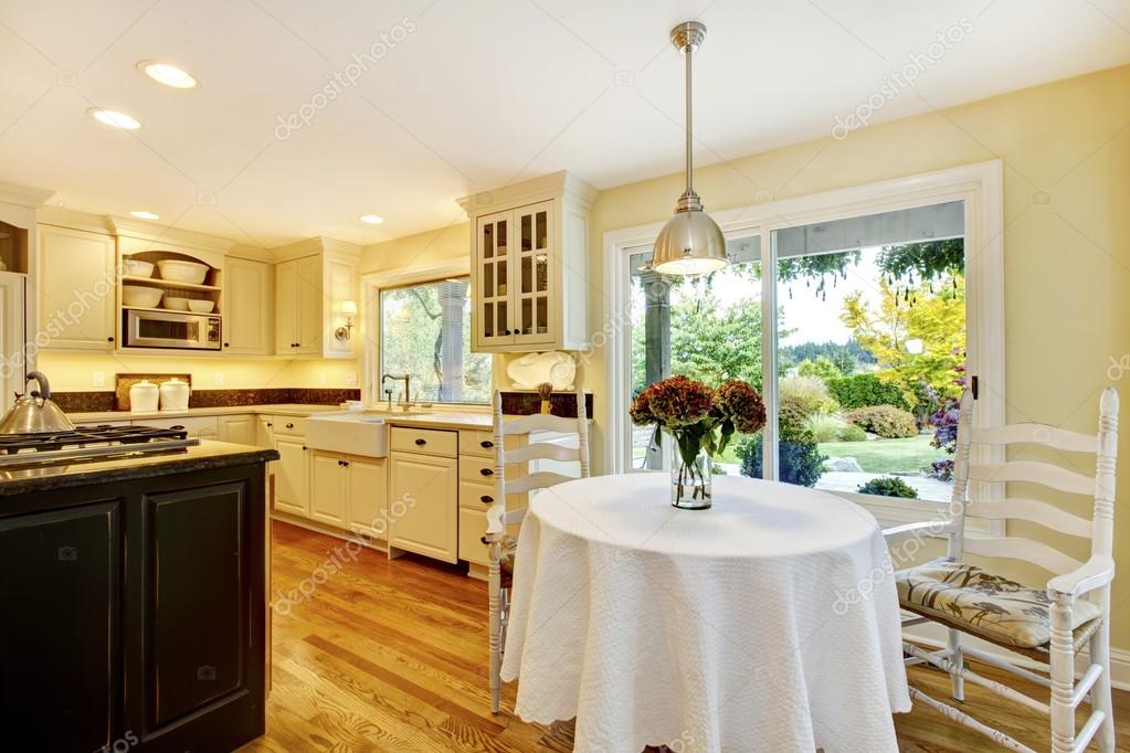Classic Design Kitchen Large Dining Table dining table with classic kitchen interior with large window stock image