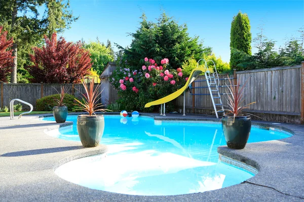 Fenced backyard with small beautiful swimming pool — Stock Photo, Image