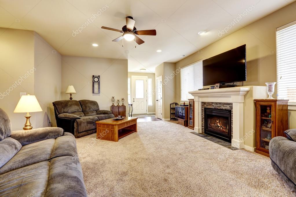 Living Room Interior In Classic American Style With Beige Walls Living Room Interior In Classic American Style With Beige Walls Gray Sofa Set And Fireplace