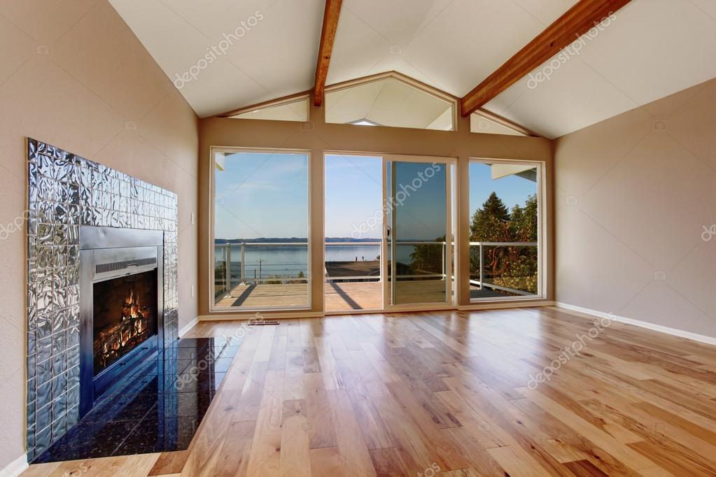 Empty Room Interior With Hardwood Floor Vaulted Ceiling And