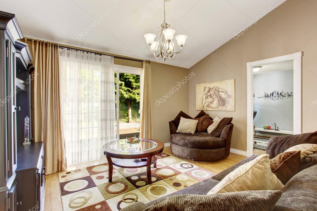 American Family Room With Brown Sofa Set And Vaulted Ceiling