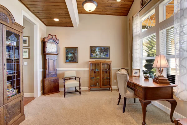 Home office with vintage furniture and carpet floor