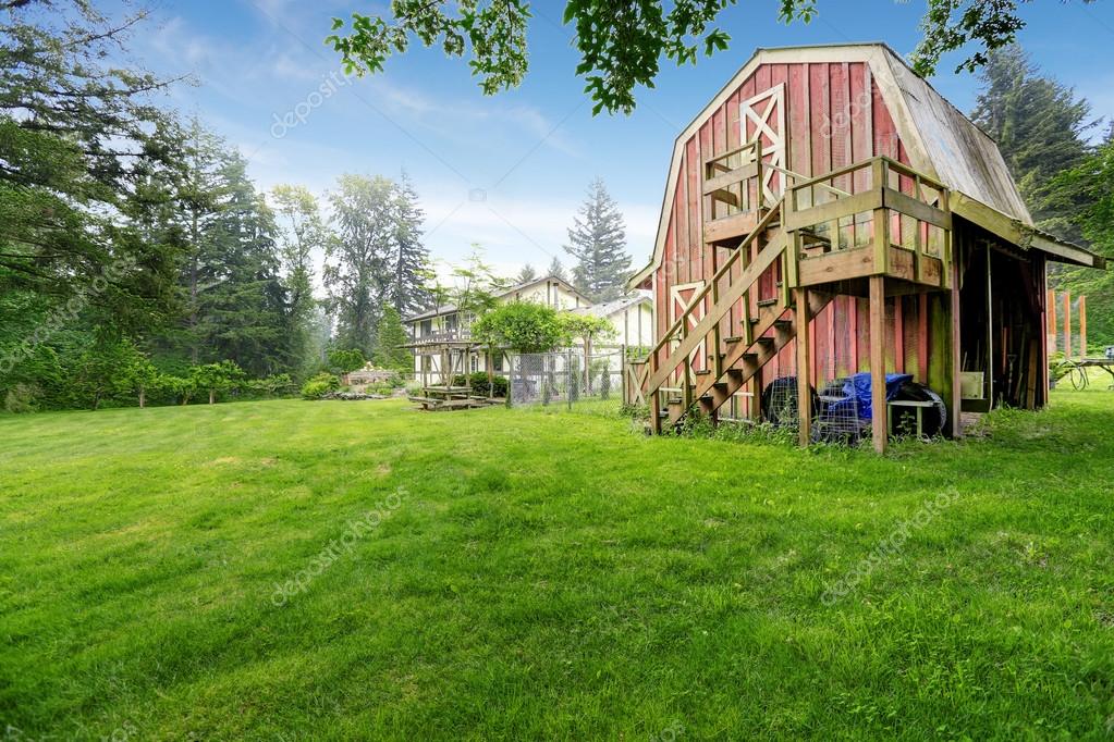 Home Garden On Backyard With Red Barn Shed Stock Photo