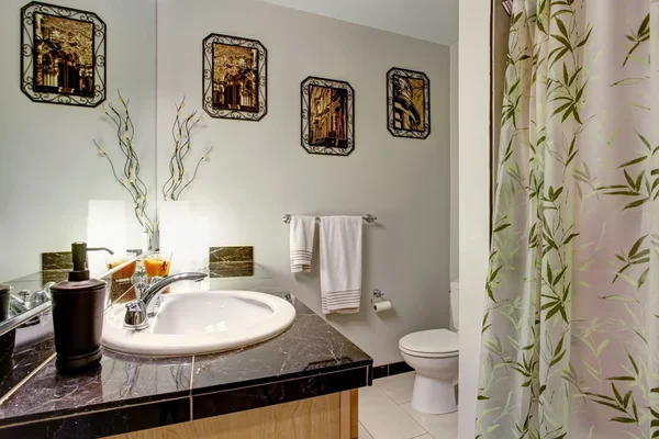 Bathroom interior with wooden cabinet and granite counter top — Stock Photo, Image