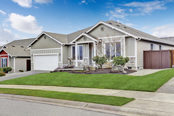 House exterior. View of entrance porch with walkway and garage