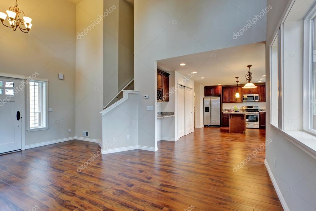 Spacious Living Room With High Vaulted Ceiling Connected To