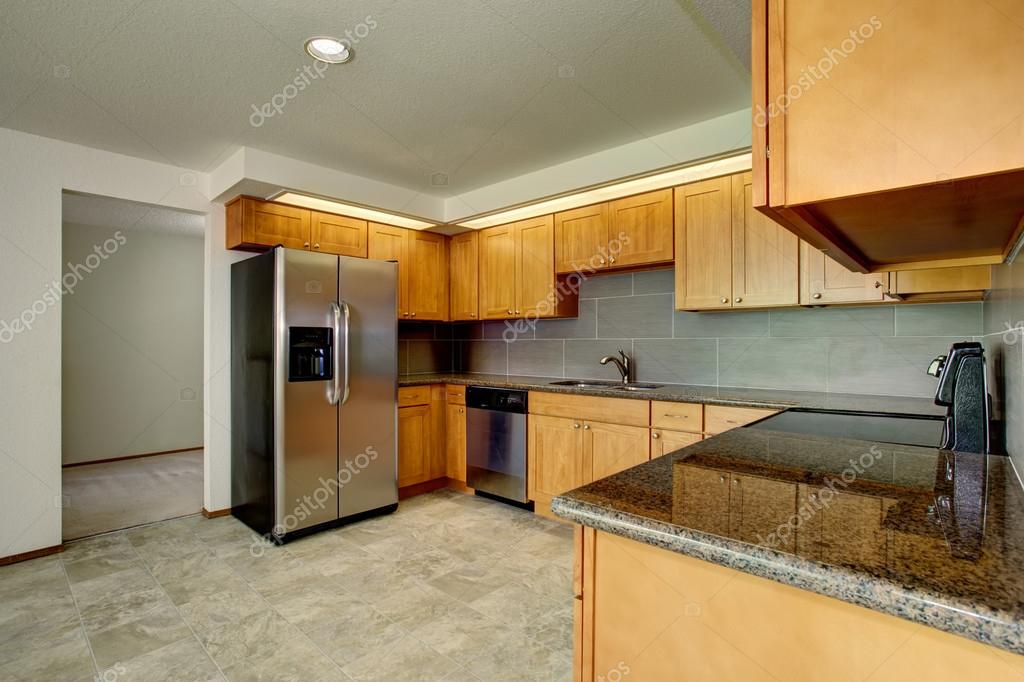 Maple Kitchen Cabinetry And Steel Appliances Kitchen Interior