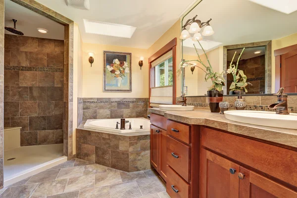 Lovely master bathroom with stone floor and large shower. — Stock Photo, Image