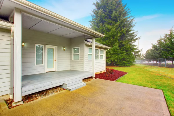 Large backyard with wood porch — Stock Photo, Image