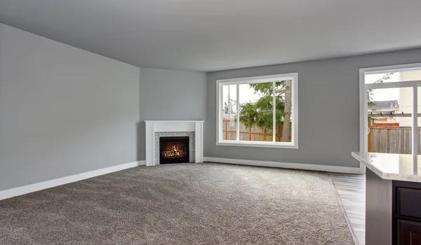 Grey house interior of living room with firwplace and carpet floor. — Stock Photo, Image