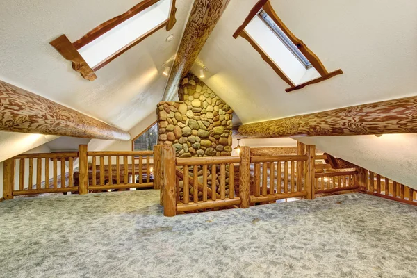 Upstairs empty room with carpet floor and pitched ceiling — Stock Photo, Image