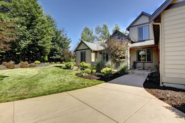 Exterior of American two story house with concrete walkway — Stock Photo, Image