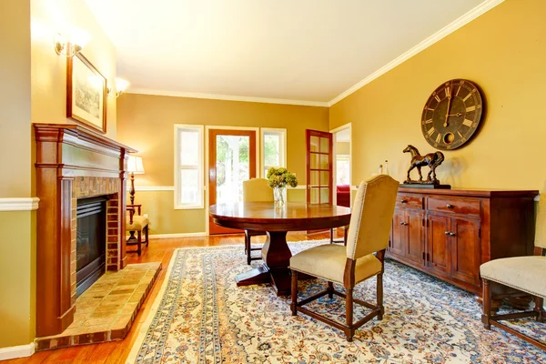 Horse ranch dining room with fireplace and wooden cabinet. — Stock Photo, Image