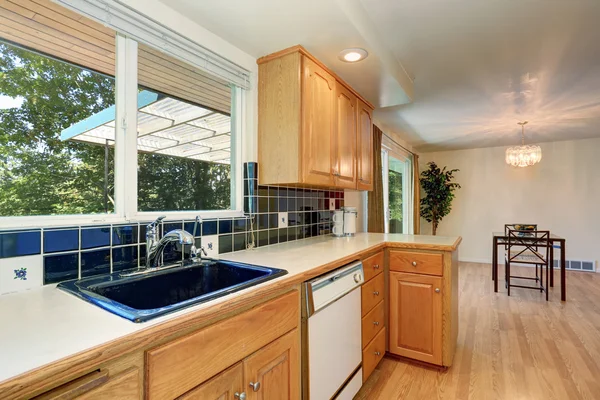 Kitchen room interior with cabinets and tile back splash trim — Stock Photo, Image