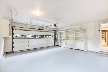 Empty garage interior in American house clipart