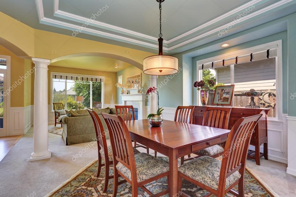 Dining Room Interior With Mint Walls And Coffered Ceiling