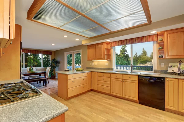 Bright wooden kitchen interior with hardwood floor. — Stock Photo, Image