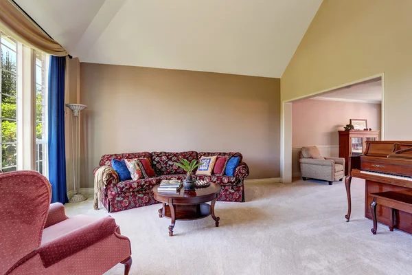 Open floor plan living room interior with lovely sofa and blue curtains — Stock Photo, Image