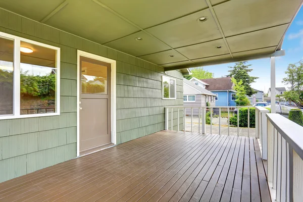 View of wooden walkout deck with white railings. — Stock Photo, Image