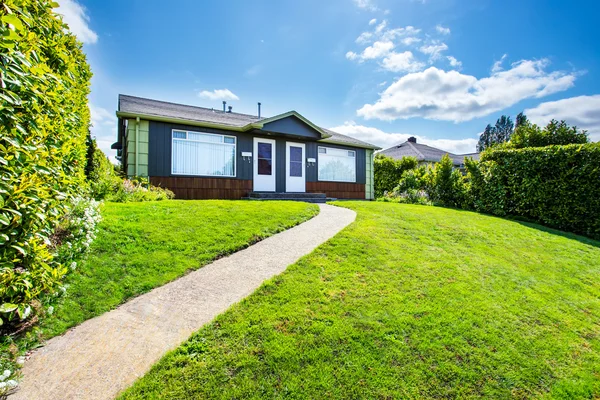 Small American two family house with concrete walkway — Stock Photo, Image