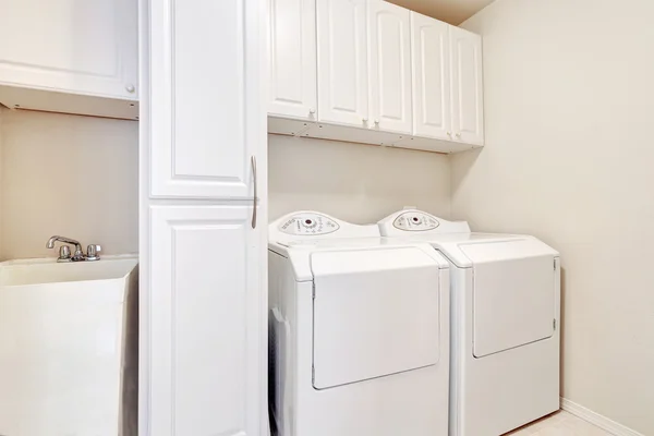 White laundry room with washer and dryer. — 스톡 사진