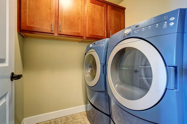 Laundry interior with modern blue appliances. — Stock Photo, Image