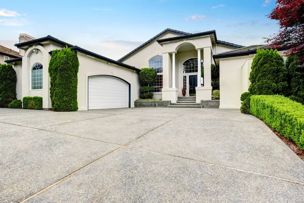 Luxury house exterior with concrete floor porch with columns — Stock Photo, Image