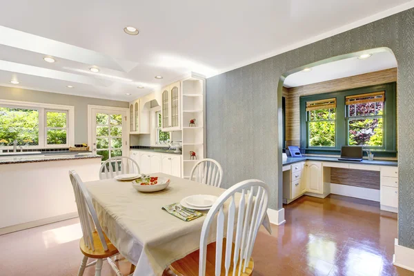 Dining area with table set in white tones and tile floor — Stock Photo, Image