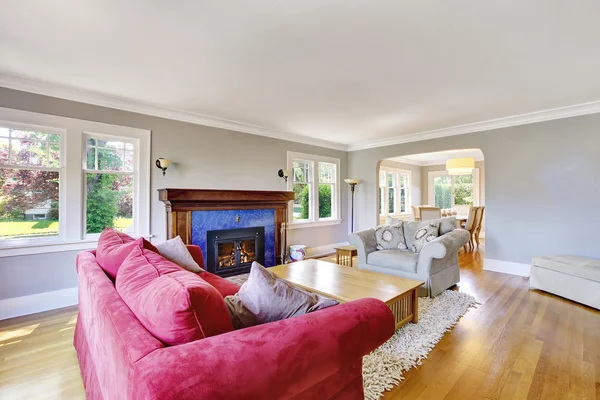 Cozy living room interior with red and beige sofas — Stock Photo, Image