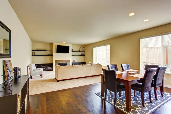 Spacious dining area with table set connected to living room — Stock Photo, Image