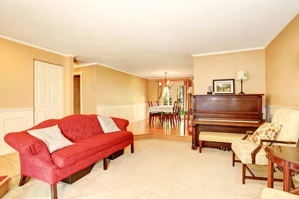 Living room interior with vintage furniture, antique piano. Connected to dining area. — Stock Photo, Image