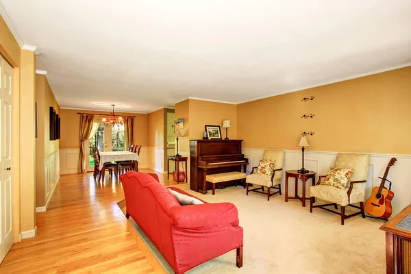 Living room interior with vintage furniture, antique piano. Connected to dining area. — Stock Photo, Image