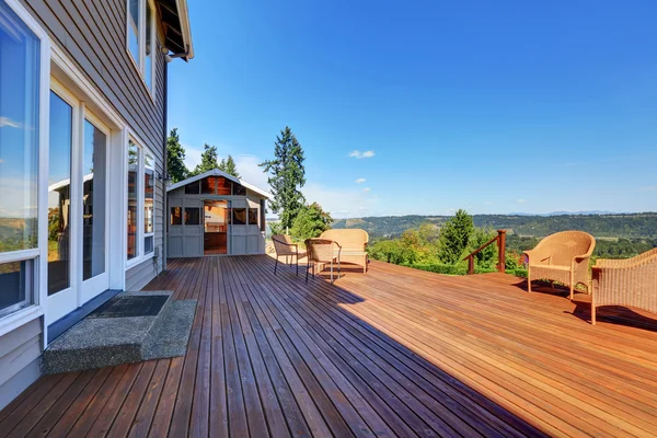 Large walkout deck with wicker furniture — Stock Photo, Image