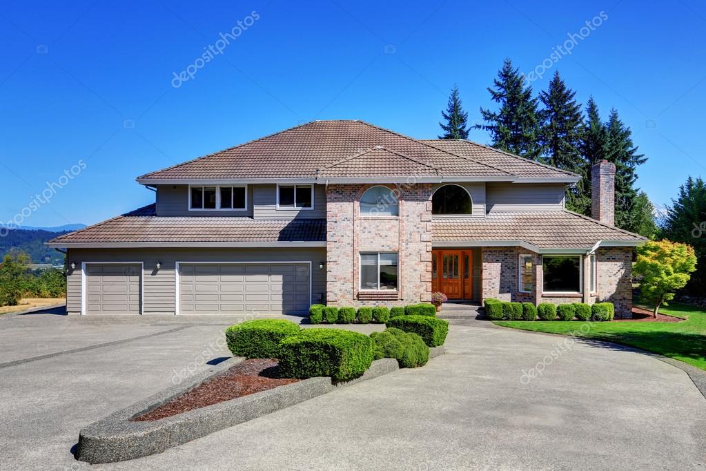 Luxury Brick House With Beautiful Curb Appeal With Perfectly Trimmed Front Lawn Double Doors Garage With Long And Wide Driveway Northwest Usa Photo By Luxury Brick House With Beautiful Curb Appeal With Perfectly Trimmed Front Lawn Double Doors Garage With Long And Wide Driveway Northwest Usa Photo By
