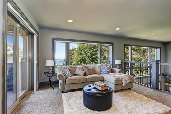 Grey interior of upstairs cozy family room with comfortable couch — Stock Photo, Image