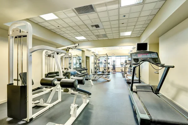 Interior of new modern gym with sport equipment — Stock Photo, Image