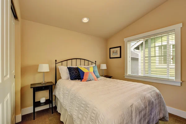 Vaulted ceiling bedroom interior in beige colors — Stock Photo, Image