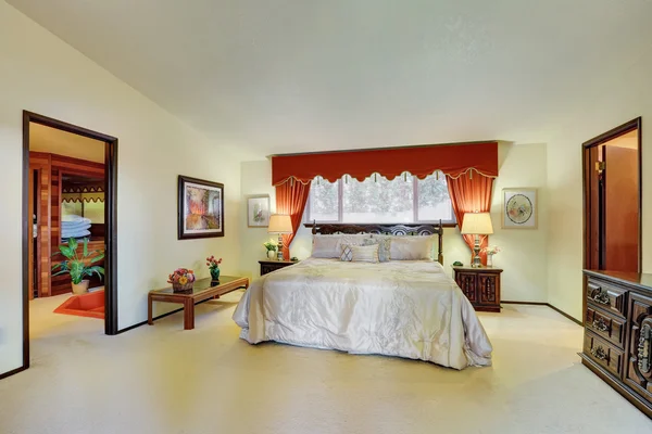 Master bedroom interior with elegant red curtains — Stock Photo, Image